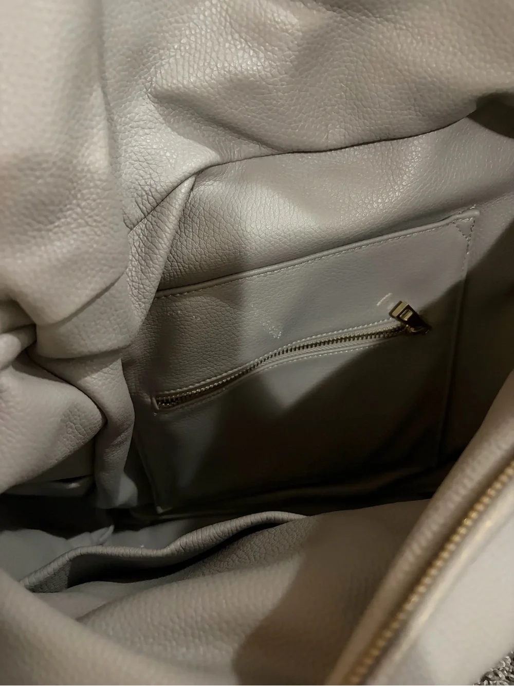 Fawn Design light cream leather backpack with gold hardware